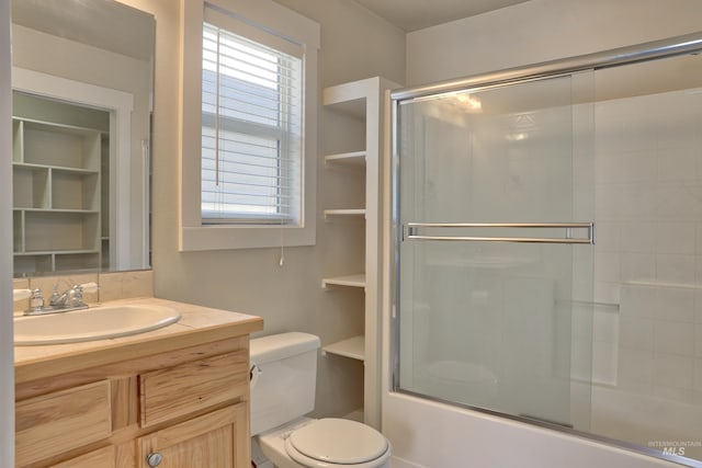 1421 S Denver Ave, Boise, ID 83706 - bathroom with plenty of natural light, toilet, shower / bath combination with glass door, and vanity
