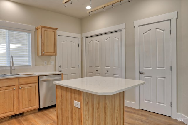 1421 S Denver Ave, Boise, ID 83706 - kitchen featuring dishwasher, a sink, light brown cabinetry, light countertops, and light wood-style floors