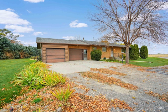 view of front facade featuring a front yard and a garage