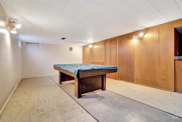 playroom with billiards and wooden walls