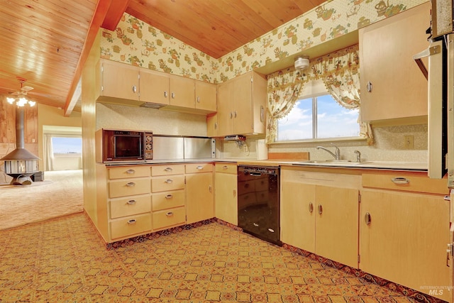 kitchen featuring light colored carpet, ceiling fan, sink, lofted ceiling with beams, and black dishwasher