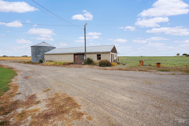 view of front of house featuring a rural view