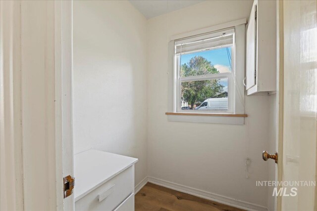 mudroom with baseboards and wood finished floors