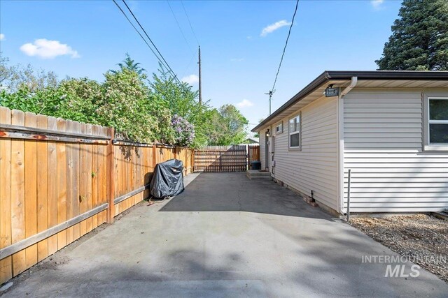 view of home's exterior featuring fence