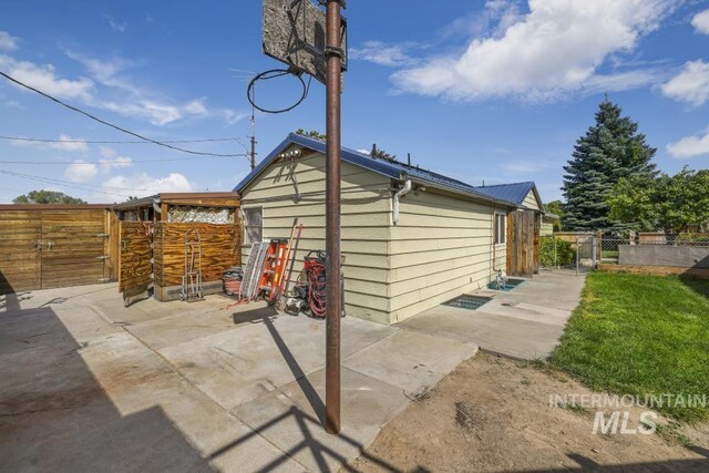 view of outbuilding with fence