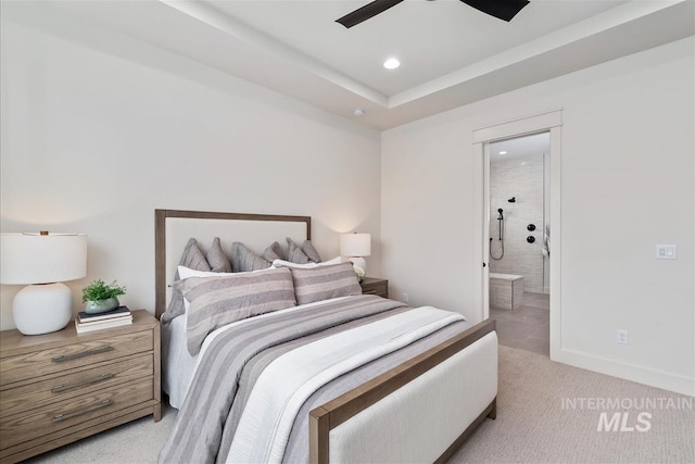 bedroom featuring recessed lighting, light colored carpet, a ceiling fan, baseboards, and ensuite bath