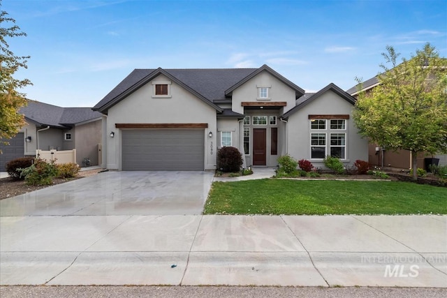 3090 NW 13th St, Meridian, ID 83646 - view of front facade with a garage, driveway, a front yard, and stucco siding