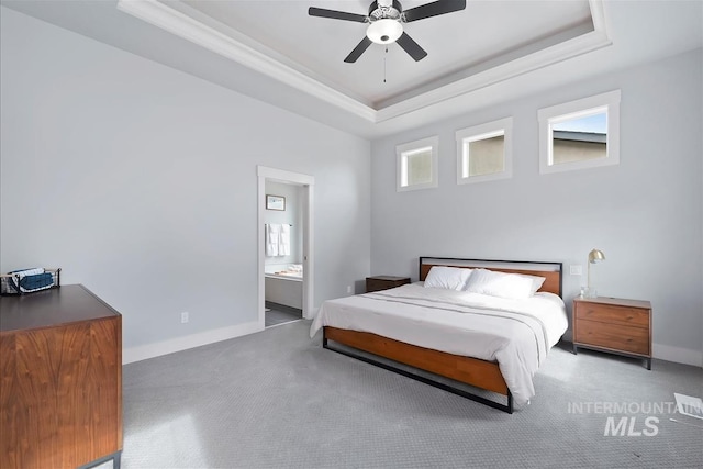 3090 NW 13th St, Meridian, ID 83646 - carpeted bedroom featuring baseboards, ornamental molding, a tray ceiling, and ensuite bath