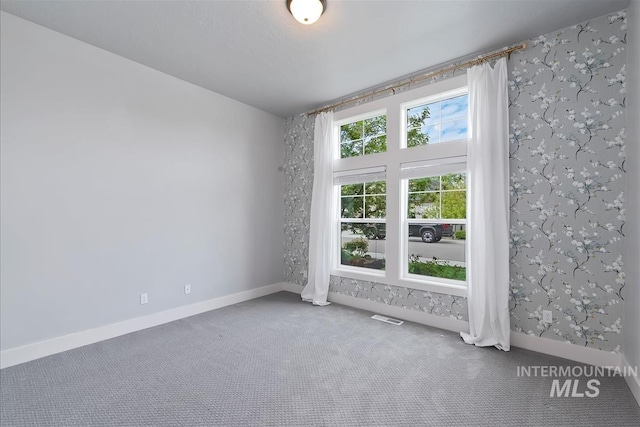 3090 NW 13th St, Meridian, ID 83646 - empty room with baseboards, carpet, and wallpapered walls