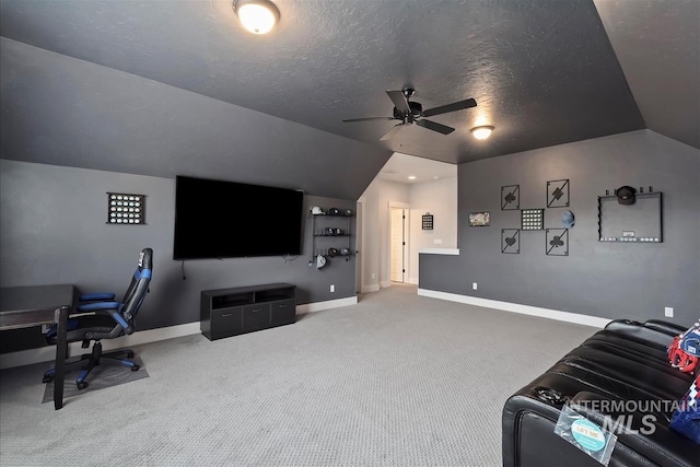 3090 NW 13th St, Meridian, ID 83646 - home theater room featuring carpet flooring, baseboards, a textured ceiling, a ceiling fan, and vaulted ceiling
