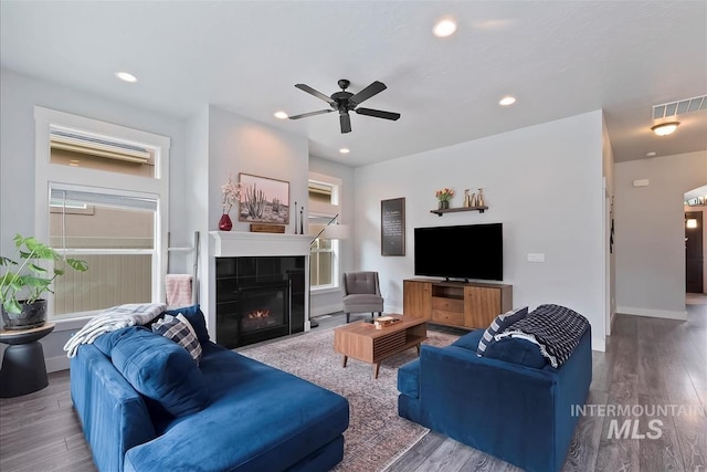 3090 NW 13th St, Meridian, ID 83646 - living room featuring a ceiling fan, visible vents, wood finished floors, a tile fireplace, and recessed lighting