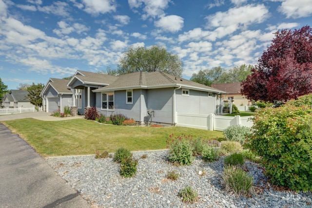 view of front of home with a garage and a front yard