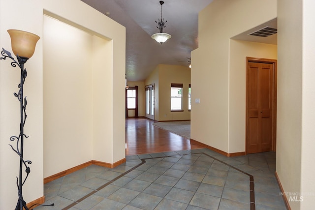 foyer entrance featuring light wood-type flooring and ceiling fan