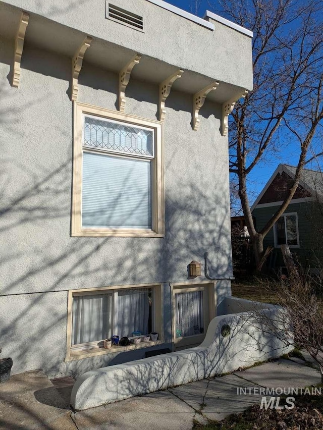 exterior space featuring stucco siding