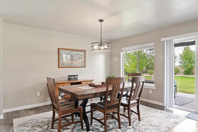 12131 W Precept Ln, Kuna, ID 83634 - dining room featuring light wood-type flooring, baseboards, and a chandelier