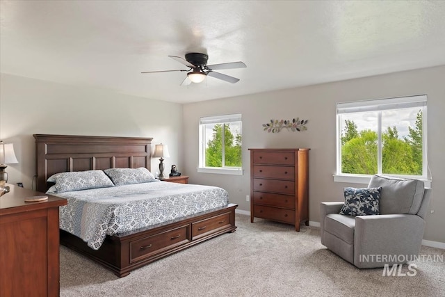 12131 W Precept Ln, Kuna, ID 83634 - bedroom featuring light colored carpet, baseboards, and ceiling fan