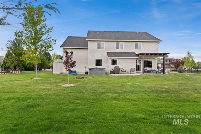 12131 W Precept Ln, Kuna, ID 83634 - back of house with a hot tub, a pergola, a patio, and a lawn