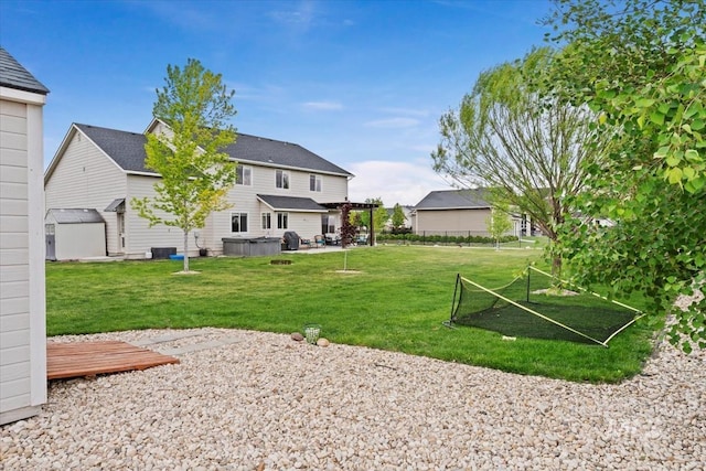 12131 W Precept Ln, Kuna, ID 83634 - view of grassy yard with a hot tub, a storage unit, a pergola, and an outdoor structure