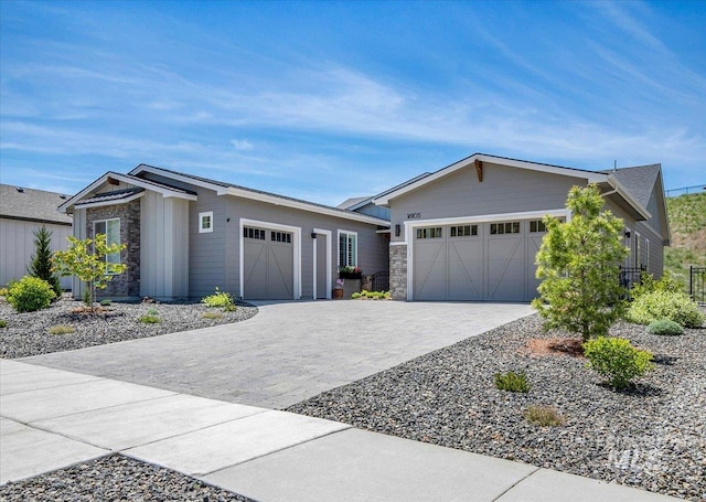 18105 N Burnt Car Way, Boise, ID 83714 - ranch-style home with stone siding, a garage, and driveway