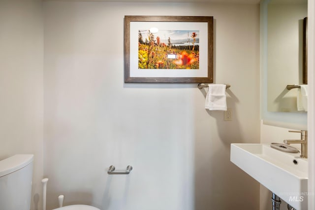 bathroom with toilet and sink