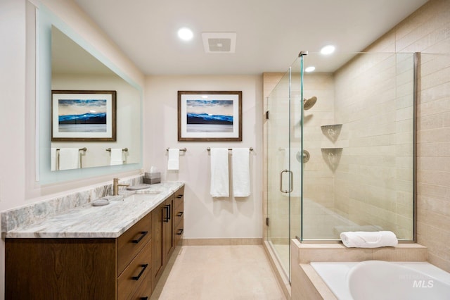 bathroom featuring independent shower and bath, vanity, and tile patterned flooring