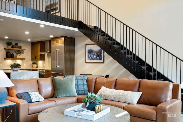 living room featuring a high ceiling