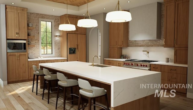 1054 N Delehaye Ave, Eagle, ID 83616 - kitchen featuring a sink, stainless steel appliances, tasteful backsplash, light wood-type flooring, and recessed lighting