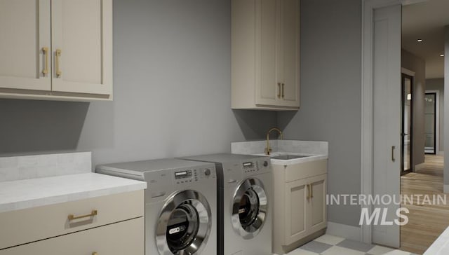 1054 N Delehaye Ave, Eagle, ID 83616 - washroom with cabinet space, washing machine and clothes dryer, light flooring, and baseboards