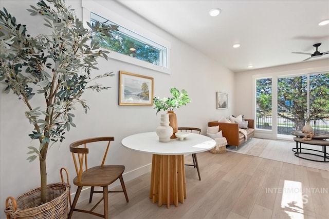 sitting room with recessed lighting, a healthy amount of sunlight, light wood-type flooring, and baseboards