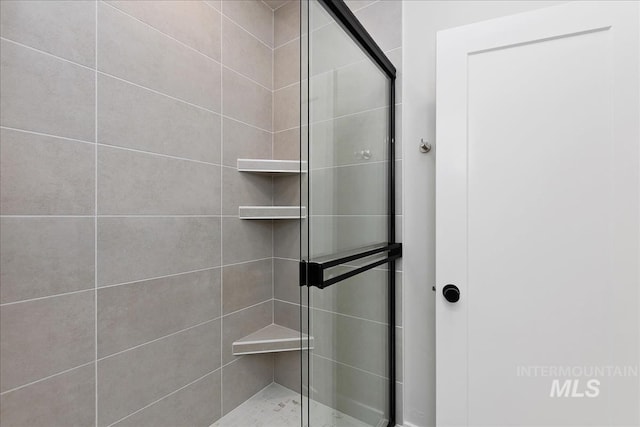 bathroom with a shower stall