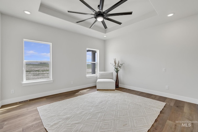 3675 E 3711 N, Kimberly, ID 83341 - unfurnished room with a tray ceiling, baseboards, a ceiling fan, wood finished floors, and recessed lighting