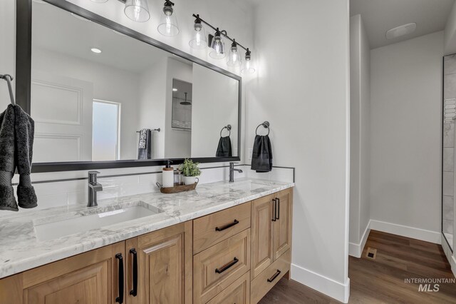3675 E 3711 N, Kimberly, ID 83341 - full bathroom with baseboards, wood finished floors, double vanity, and a shower