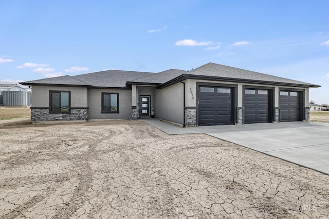 3675 E 3711 N, Kimberly, ID 83341 - prairie-style house featuring stucco siding, driveway, an attached garage, and roof with shingles