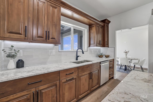 3675 E 3711 N, Kimberly, ID 83341 - kitchen with a sink, stainless steel dishwasher, light stone countertops, wood finished floors, and tasteful backsplash