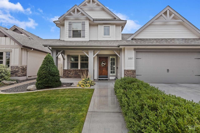 craftsman-style home with a front yard and a garage