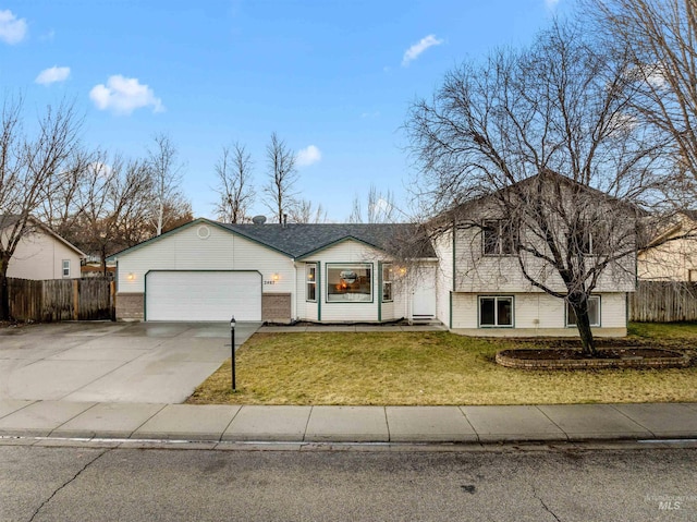 view of front of house with a garage and a front yard