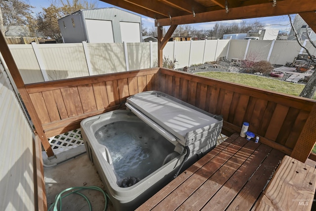 wooden terrace with a hot tub