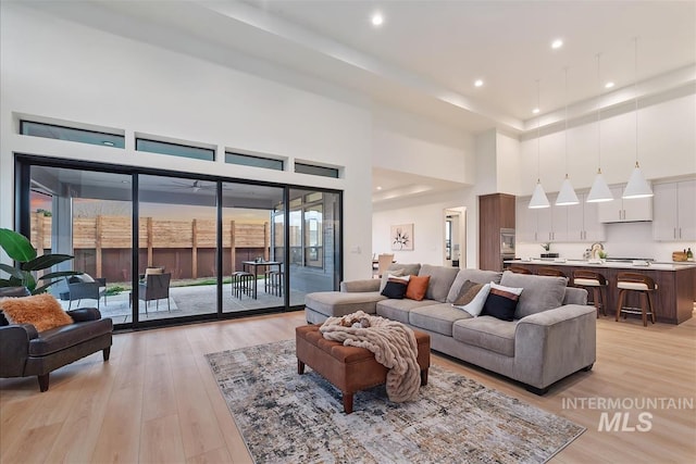 9891 W Napier Ct, Star, ID 83669 - living room with light wood-type flooring, recessed lighting, and a high ceiling