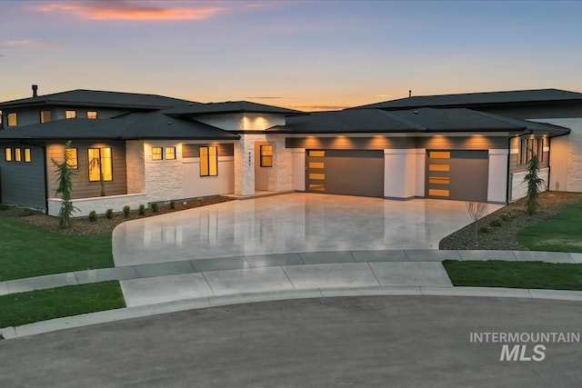 9891 W Napier Ct, Star, ID 83669 - prairie-style house with an attached garage, a front yard, stone siding, and concrete driveway