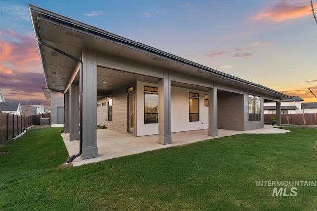 9891 W Napier Ct, Star, ID 83669 - back of house with a fenced backyard, a patio area, and a yard
