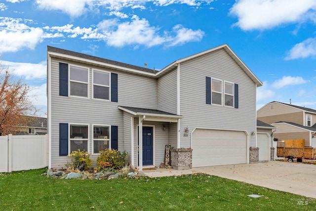 view of front facade featuring a garage and a front lawn