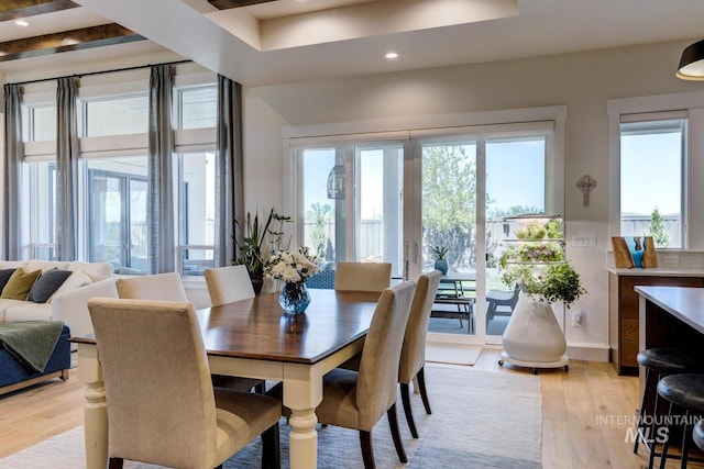 dining room with light wood finished floors and recessed lighting