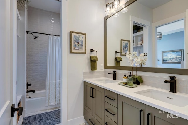 full bath featuring decorative backsplash, shower / bathtub combination with curtain, double vanity, and a sink