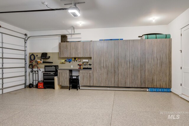 garage featuring a garage door opener