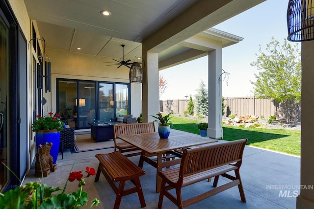 view of patio / terrace featuring outdoor dining area and fence