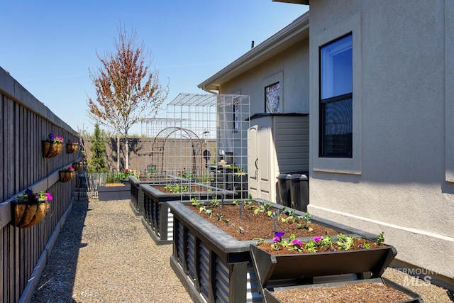 view of yard with a garden and fence