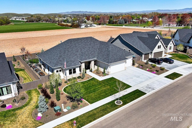 bird's eye view featuring a residential view and a mountain view