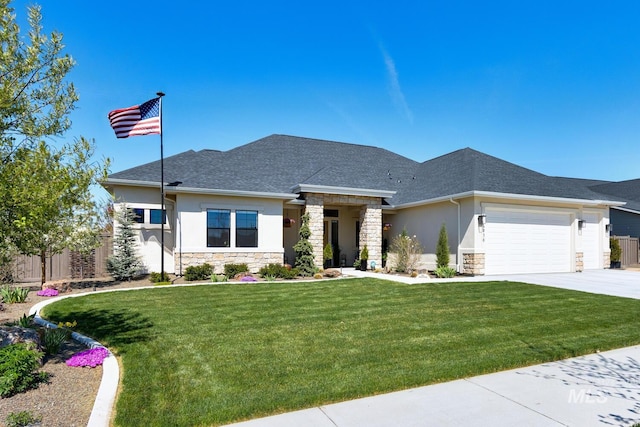prairie-style home with stucco siding, driveway, stone siding, a front lawn, and a garage