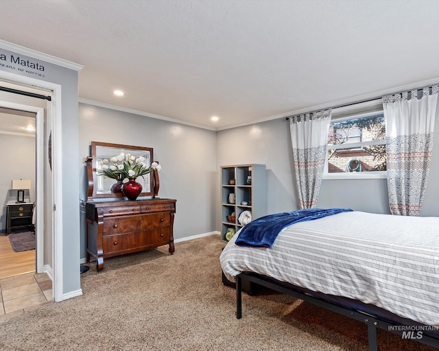 bedroom with baseboards, carpet flooring, and crown molding