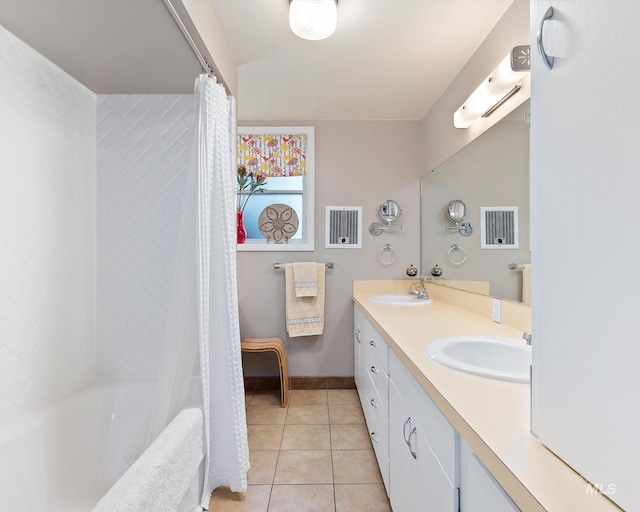 full bathroom with double vanity, shower / bath combo, a sink, and tile patterned floors